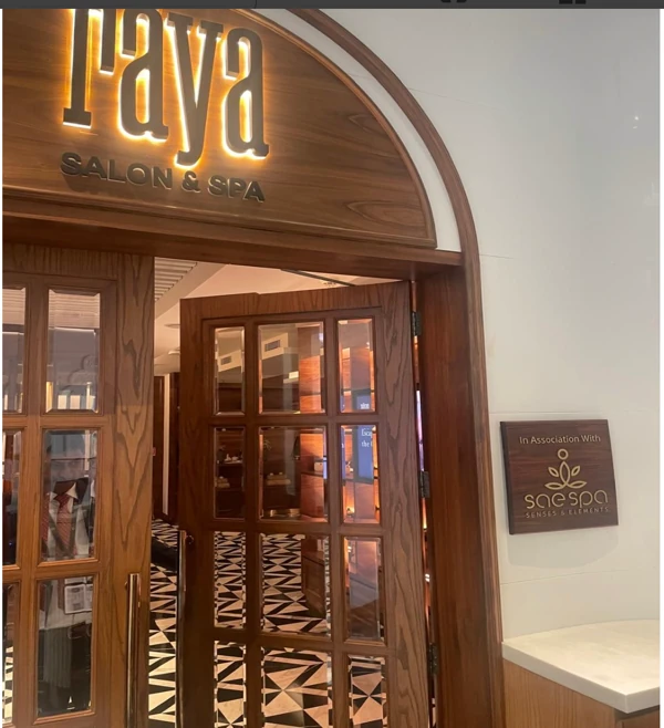 Raya Salon and Spa entrance with wooden doors and SAE Spa sign