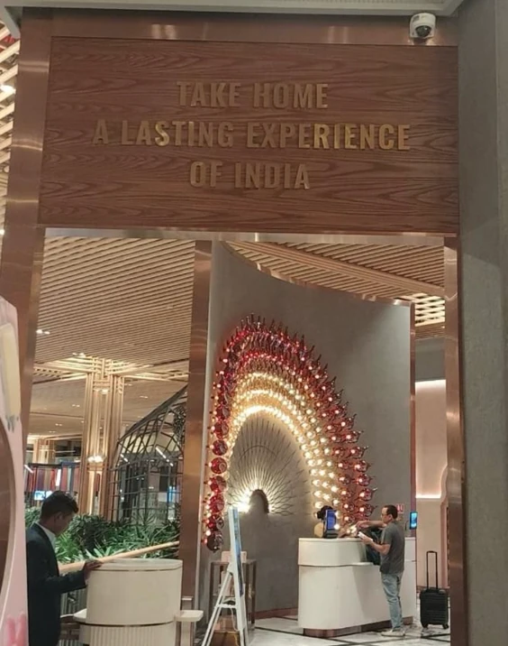Spa entrance at the airport with carved wooden surround and circular illuminated feature